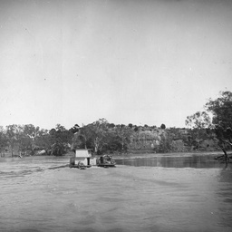 Small river craft and barge on the Murray River, South Australia