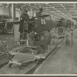 Employees working on aircraft fuselages.