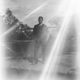 Boy posing in rural landscape