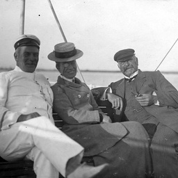 A happy group of three sailing on board the S.S. Governor Musgrave