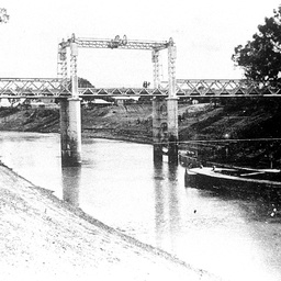 Wilcannia Bridge on the Darling with a barge in low river