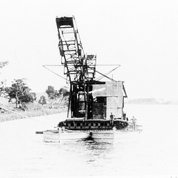 Transporting an excavator on barges near Murray Bridge