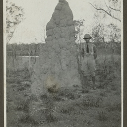 Keith Smith by a termite mound.