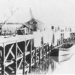 Echuca wharf with large squares possibly canvas overhanging to dry