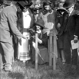 Miss Moss planting a tree