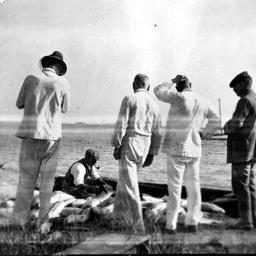 Fishermen looking at their catch on the banks of the Murray River