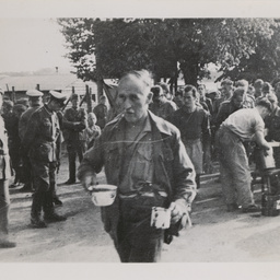 Prisoners of War in line for food.
