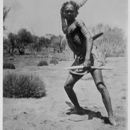 Aboriginal warrior throwing a boomerang