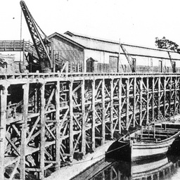 Echuca Wharf showing its structure, with two barges tied up