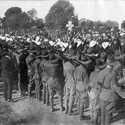 Soldiers firing the last salute at the funeral of Colonel Havilland Le Mesurier