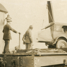 Unloading tourist car from train at Oodnadatta