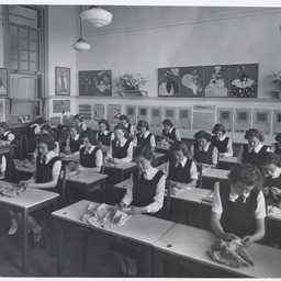 Schoolgirls at a dressmaking class