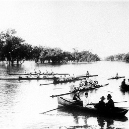 Wilcannia Rowing Club boats on the water with onlookers