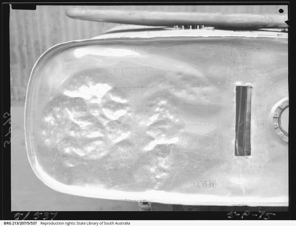 Damaged Beaufort petrol tank • Photograph • State Library of South