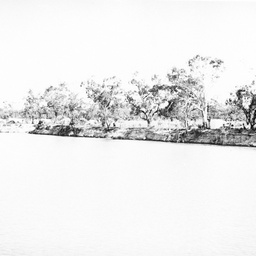Distant view of riverfront shacks below Berri