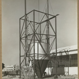 Erecting 'Cyclone' dust extractor.