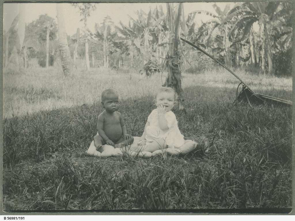 Two babies seated on a rug • Photograph • State Library of South Australia
