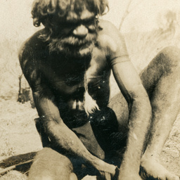 Aboriginal man making a fire