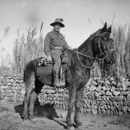 Australian soldier on a horse.