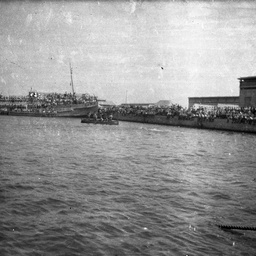 Troopships at a port.