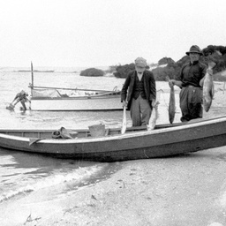 George and Andy Ross holding up their catch of butterfish at the Coorong