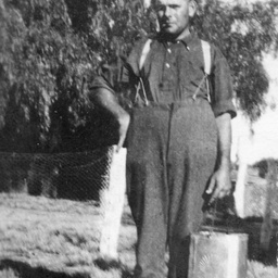 Young man carrying a kerosene can