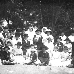 Seven nurses with a group of women