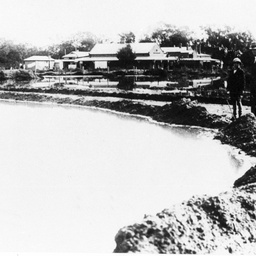 Two men inspecting the 1931 flood scene at Berri