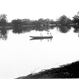 River scene at Waikerie with two women being rowed on the river