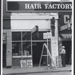 Workmen with ladders in Hindley Street