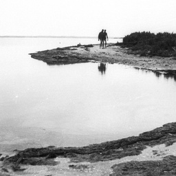 Two people walking at the lower end of the Coorong