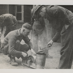 Prisoners of War cooking food.