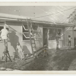 Volunteers working on a building