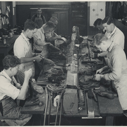 Young men attending a boot making class