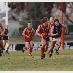 Photographs relating to football, including Adelaide Crows