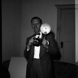 Vic Grimmett holding a camera